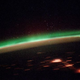 Illustration for article titled Holy crap! Why is the Earth glowing green?